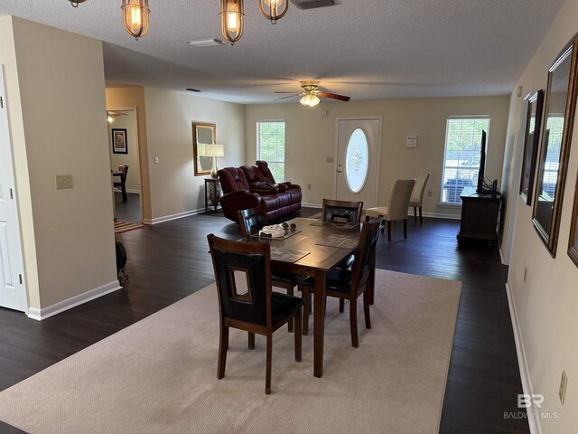 28712 Canal Rd, Orange Beach, AL 36561 - dining space with a ceiling fan, wood finished floors, a textured ceiling, and baseboards