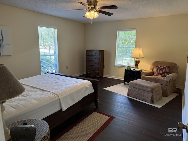 28712 Canal Rd, Orange Beach, AL 36561 - bedroom with wood finished floors, baseboards, and a ceiling fan