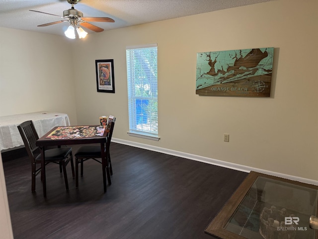 28712 Canal Rd, Orange Beach, AL 36561 - dining area featuring dark wood-type flooring, ceiling fan, and baseboards