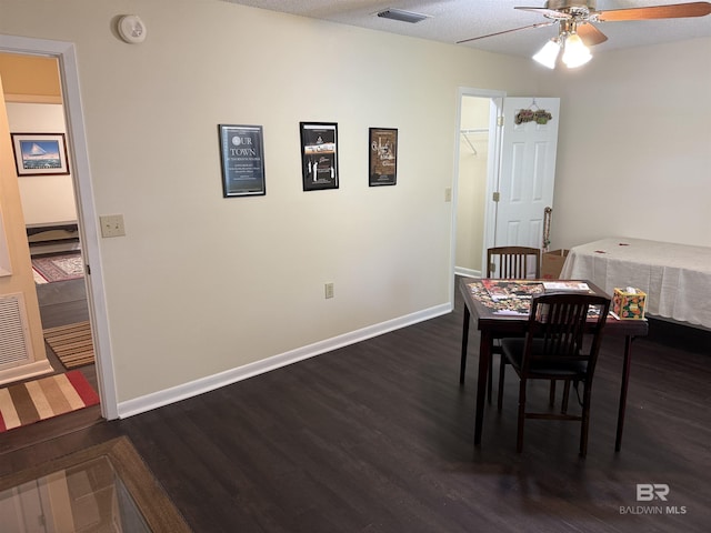 28712 Canal Rd, Orange Beach, AL 36561 - dining room featuring dark wood-style floors, ceiling fan, and baseboards