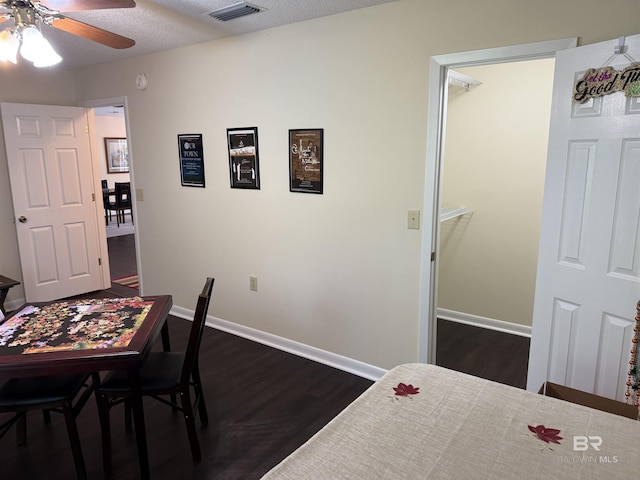 28712 Canal Rd, Orange Beach, AL 36561 - dining room with a ceiling fan, dark wood-style floors, and baseboards