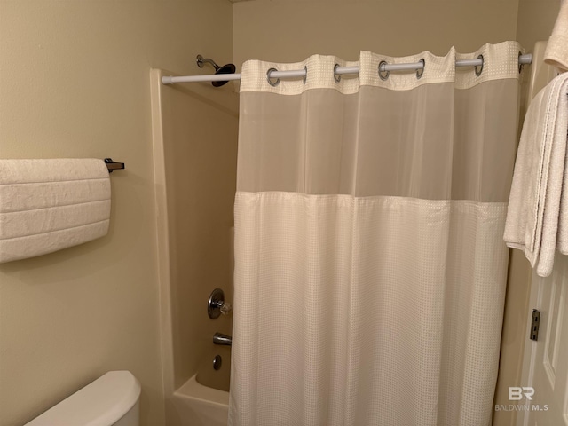 28712 Canal Rd, Orange Beach, AL 36561 - bathroom featuring shower / bath combination with curtain and toilet