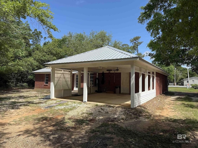 28712 Canal Rd, Orange Beach, AL 36561 - garage featuring a carport and driveway
