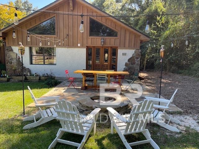 view of patio / terrace featuring an outdoor fire pit