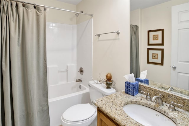 bathroom featuring toilet, vanity, and shower / bath combo
