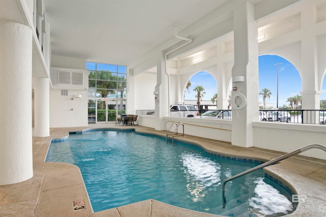 view of pool featuring a hot tub