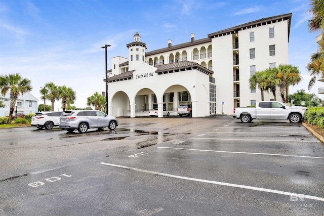 view of property with uncovered parking