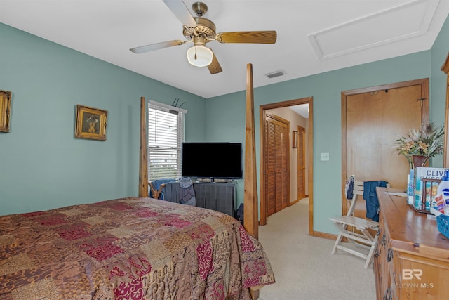 bedroom featuring ceiling fan and light carpet