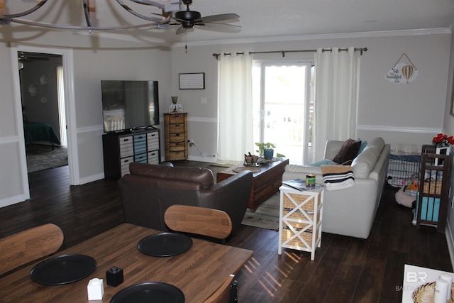 living room with dark wood finished floors, baseboards, ceiling fan, and ornamental molding