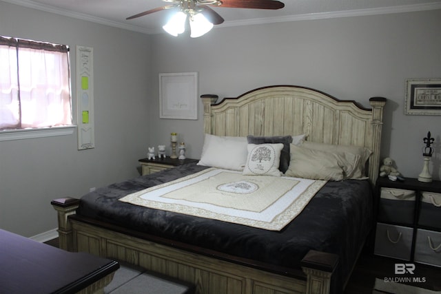 bedroom with a ceiling fan and crown molding