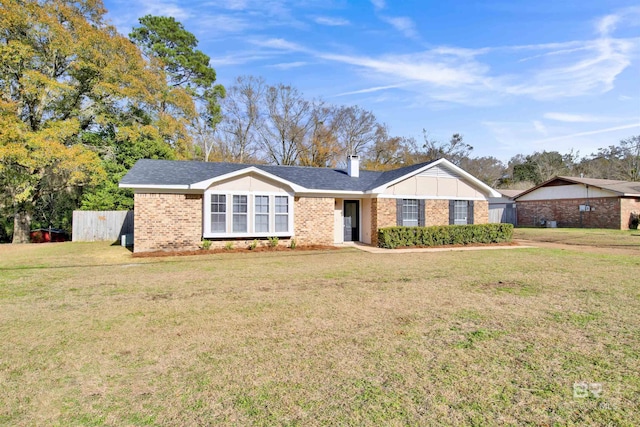 ranch-style house with a front lawn