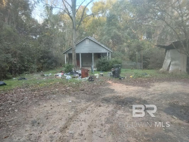 view of yard with a view of trees