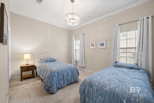 carpeted bedroom featuring crown molding and a notable chandelier