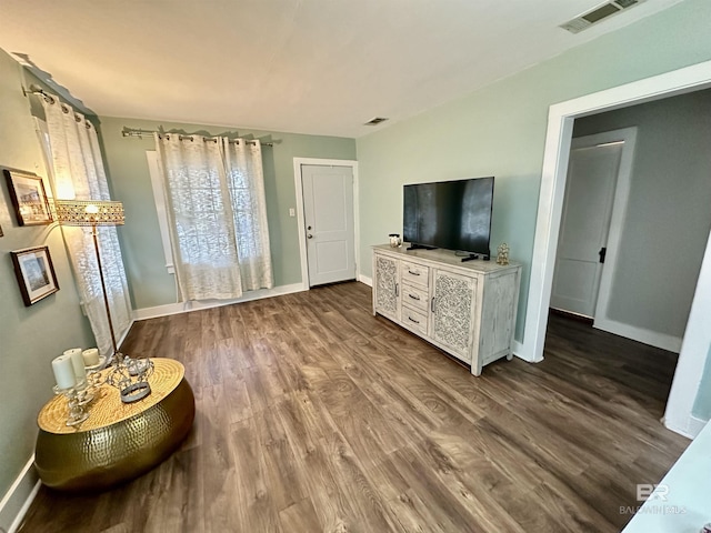 living room featuring dark wood-type flooring