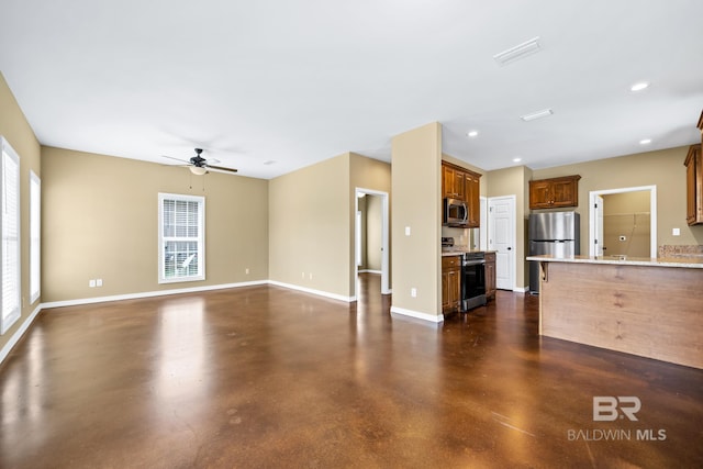 unfurnished living room featuring ceiling fan