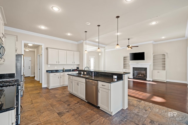 kitchen featuring white cabinets, decorative light fixtures, ceiling fan, and appliances with stainless steel finishes