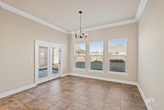 unfurnished dining area with a chandelier, ornamental molding, and a healthy amount of sunlight