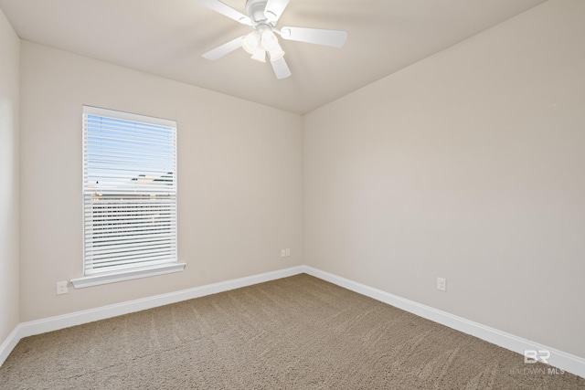 carpeted empty room featuring ceiling fan