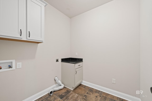 clothes washing area with hookup for an electric dryer, hookup for a washing machine, and cabinets