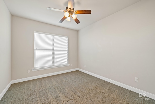 unfurnished room with ceiling fan and carpet