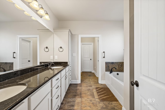 bathroom with a bathing tub and vanity