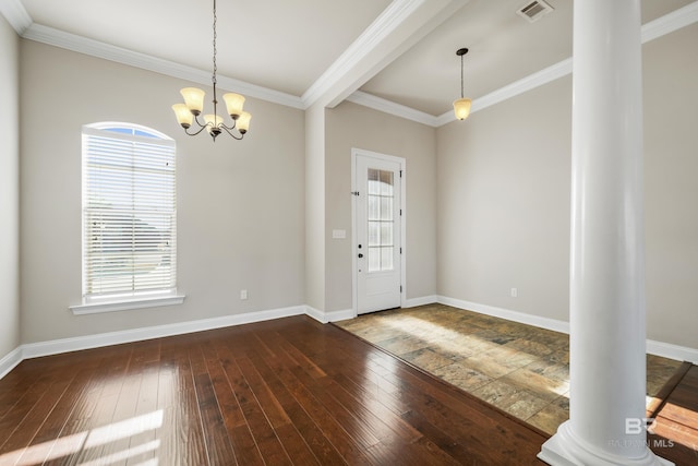 unfurnished room featuring a healthy amount of sunlight, hardwood / wood-style flooring, ornate columns, and ornamental molding