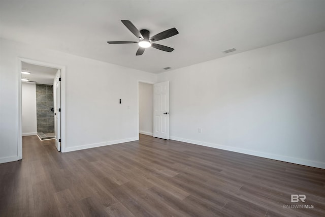 unfurnished bedroom with baseboards, visible vents, ceiling fan, and dark wood-type flooring