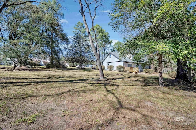 view of yard with a wooden deck