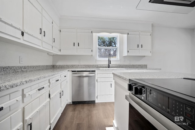 kitchen featuring stove, dark wood-type flooring, stainless steel dishwasher, white cabinetry, and a sink