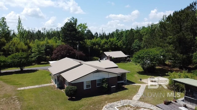 drone / aerial view with a view of trees