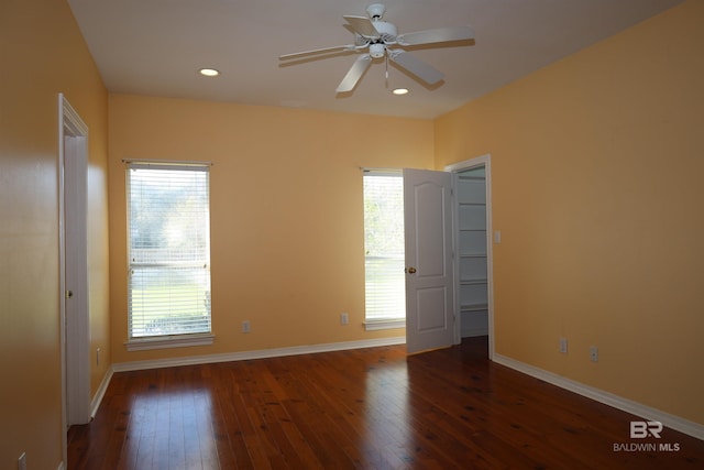 unfurnished room featuring a healthy amount of sunlight and hardwood / wood-style floors