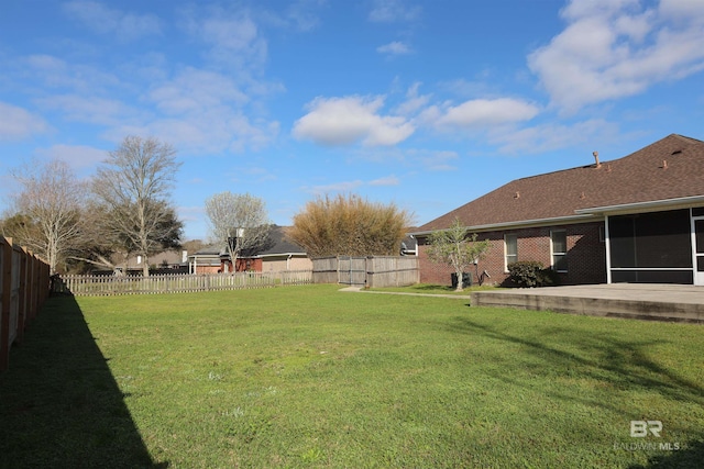 view of yard with a fenced backyard