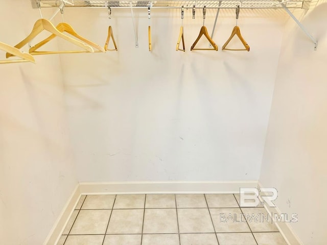 spacious closet featuring light tile patterned flooring