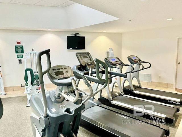 gym featuring recessed lighting, visible vents, and a drop ceiling