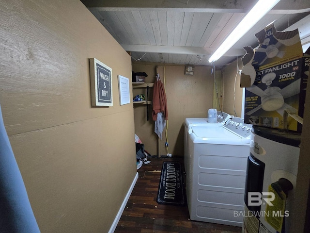 clothes washing area featuring washing machine and clothes dryer, water heater, dark hardwood / wood-style flooring, and wood ceiling