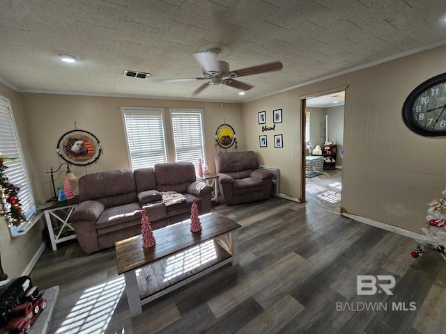 living room with ceiling fan, dark hardwood / wood-style floors, and ornamental molding