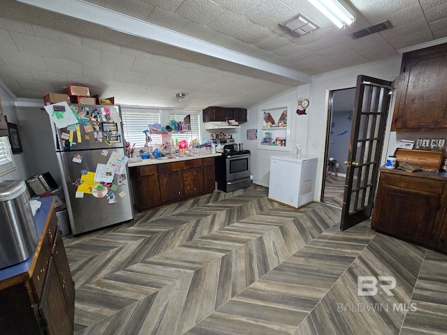 kitchen featuring dark brown cabinets, sink, stainless steel appliances, and dark parquet flooring