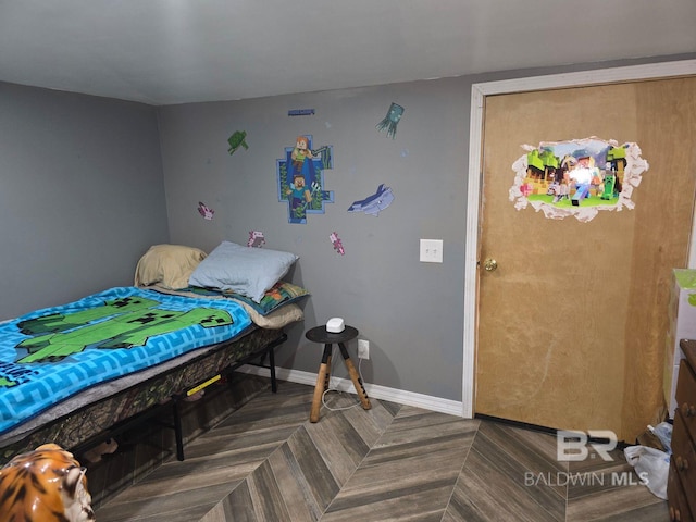 bedroom featuring parquet flooring