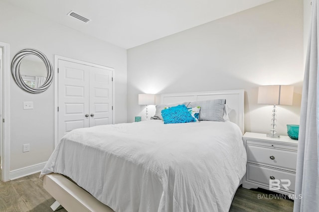 bedroom featuring hardwood / wood-style flooring and a closet