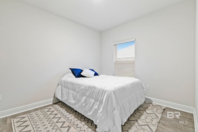 bedroom featuring wood-type flooring