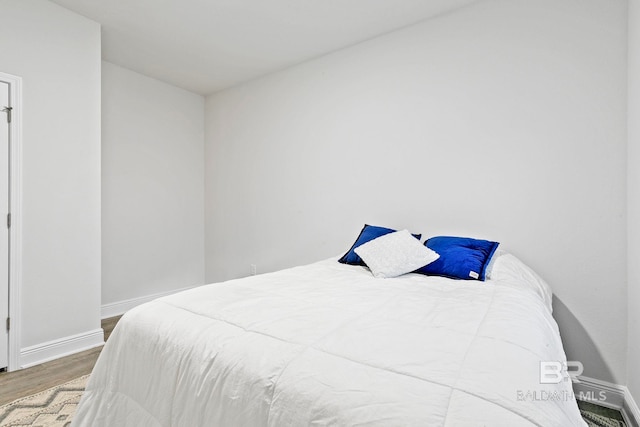 bedroom featuring wood-type flooring