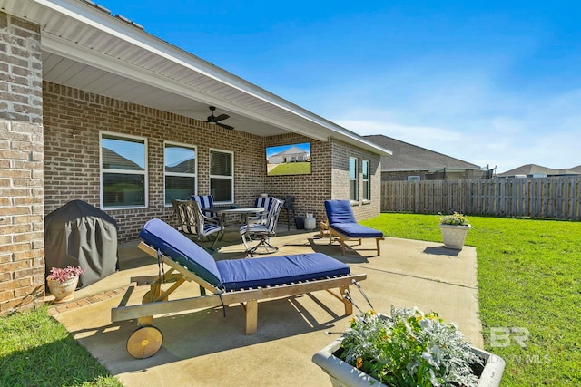 view of patio featuring ceiling fan