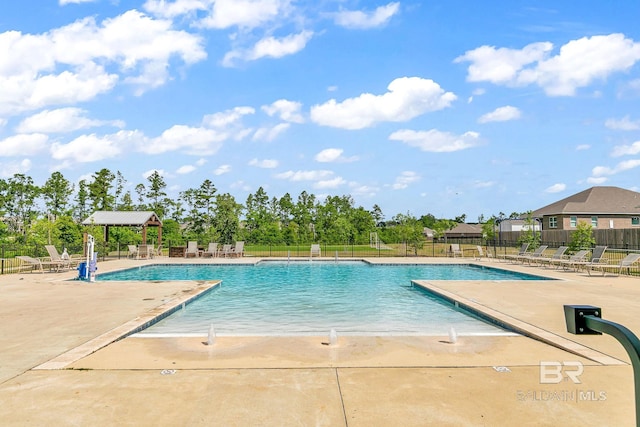 view of swimming pool featuring a patio area