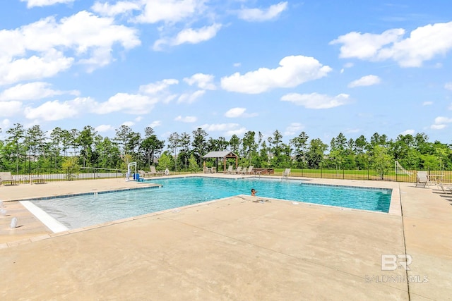 view of swimming pool featuring a patio area