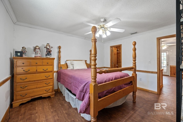 bedroom with crown molding, dark wood-type flooring, a textured ceiling, and ceiling fan