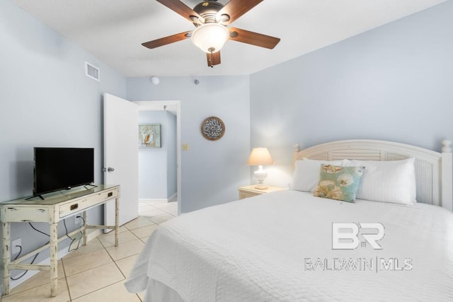 tiled bedroom featuring ceiling fan