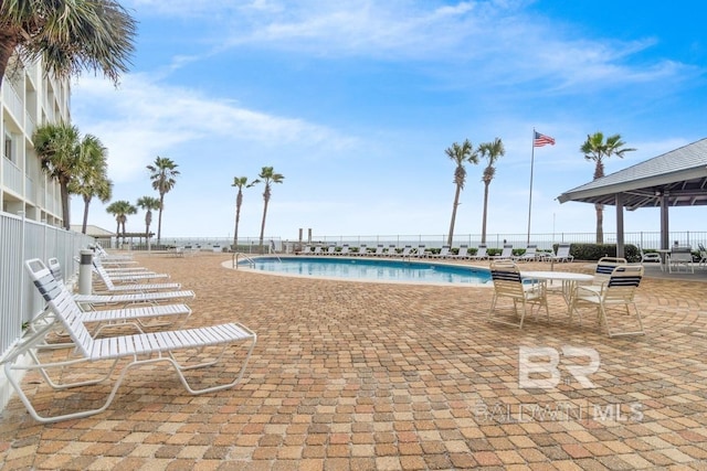 view of swimming pool with a patio area