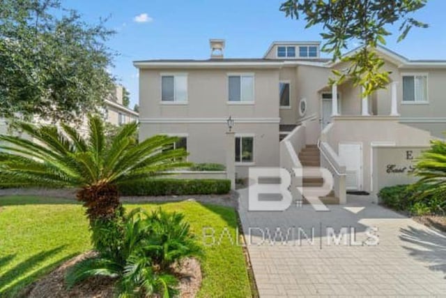200 Peninsula Blvd Unit E101, Gulf Shores, AL 36542 - view of front facade with stucco siding