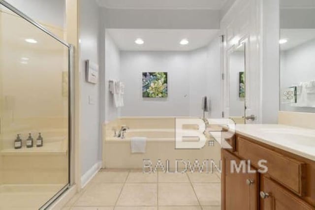 200 Peninsula Blvd Unit E101, Gulf Shores, AL 36542 - full bathroom featuring a shower stall, vanity, tile patterned flooring, a bath, and recessed lighting
