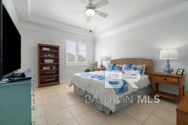 200 Peninsula Blvd Unit E101, Gulf Shores, AL 36542 - bedroom featuring light tile patterned floors, a raised ceiling, crown molding, and a ceiling fan